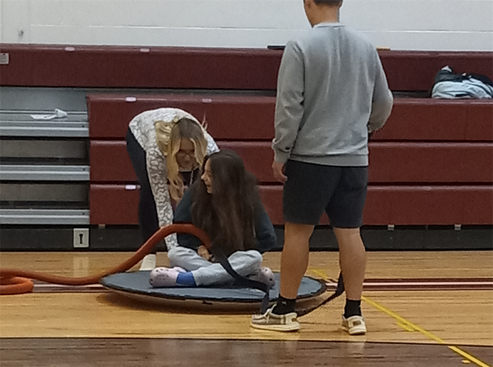  technology students on hoverboards